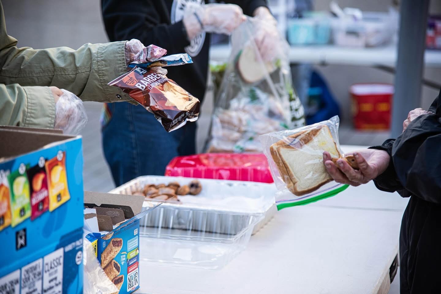 Volunteers handing out food at the pop-up café